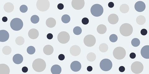 A pattern of varying-sized circles in shades of blue, gray, and navy on a light blue background, creating a playful design.