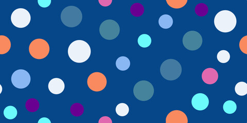Colorful polka dots in various sizes and hues scattered across a deep blue background, creating a playful and vibrant pattern.