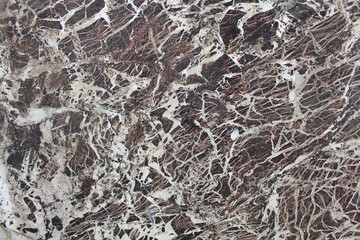 Dark Marble Stone Texture with White Veins. A high-resolution close-up of natural marble stone featuring deep brown and black tones with intricate white veining. 