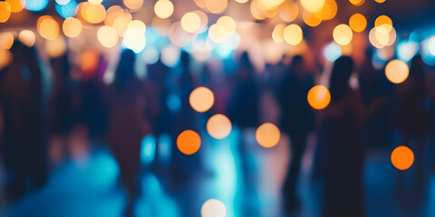 Blurred figures of people dancing in a hall with glowing bokeh lights, capturing the warm, festive atmosphere of a joyous celebration or elegant event,  