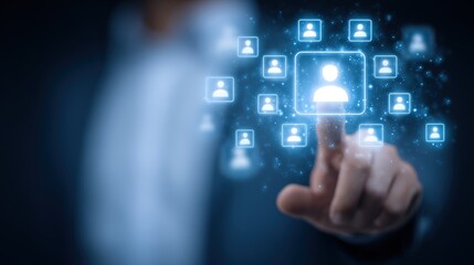 A person touching a digital interface with glowing profile icons in a dark blue environment