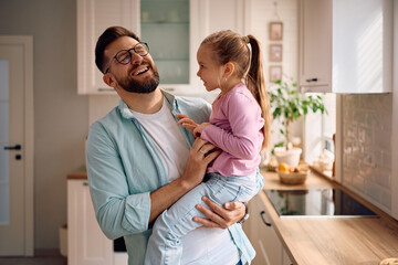 Fototapeta premium Cheerful father and daughter having fun at home.