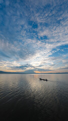 Boat on Calm Water at Sunset