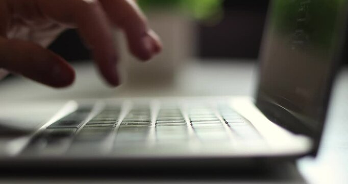 Alternative macro close up of an young businessman hands busy working on laptop or computer keyboard for send emails and surf on a web browser.
