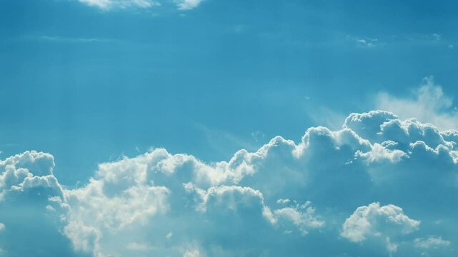 The Serene Blue Sky with Fluffy White Clouds during a Bright and Beautiful Daylight Time lapse.