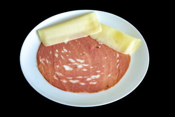 Close-up of a sliced bologna on a white plate