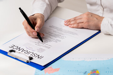 Filling Out Official Insurance Document in Office Setting