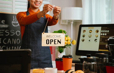 Barista in coffee shop preparing espresso drinks, working with coffee machine in a comfortable indoor atmosphere, representing small business and service.