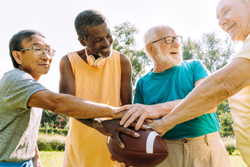 Group of senior friends playing at the park