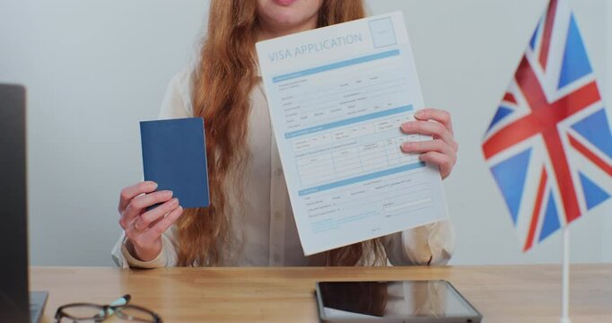 British embassy woman officer showing visa application and passport, legal immigration, tourist interview.