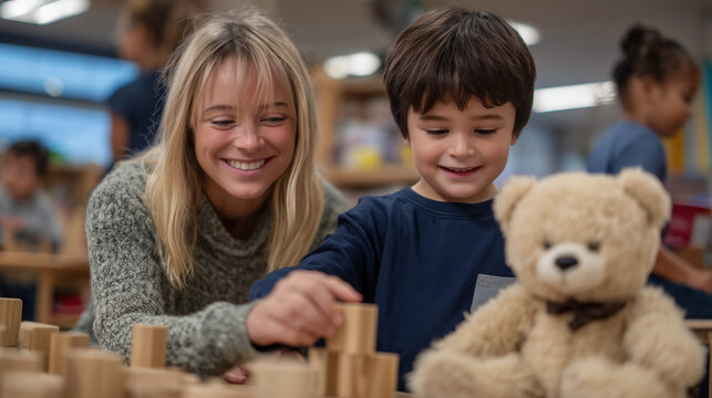 Wide-angle of inclusive classroom showing other children and aides, while main focus is teacher and student building confidence with blocks