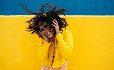 Young happy woman dancing and having fun outdoor.