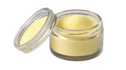 Small open glass jar containing yellow paste like filler with some of the filler also present on the inside of the lid, isolated on transparent background
