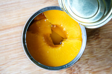 Open Tin Or Can Of Sliced Peaches Dessert Or Cooking Ingredients