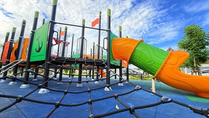 Slider bar toy outdoor playground, exercise of motor development. Outdoors, development and portrait of kids for playing, freedom and summer adventure with smile.