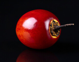 tamarillo isolated on a black background