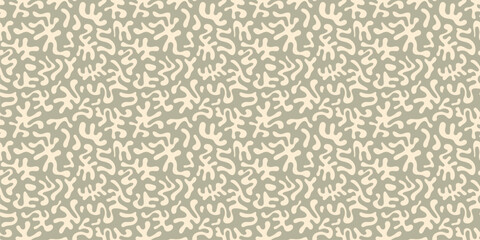 Vector abstract seamless pattern with organic shapes, funky chaotic doodle elements. Groovy cut-out texture. Simple camouflage green background. Stylish repeating design