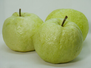 Two Whole Green Guavas Close-Up – Fresh Tropical Fruits on White Studio Background for Food and Health Concept