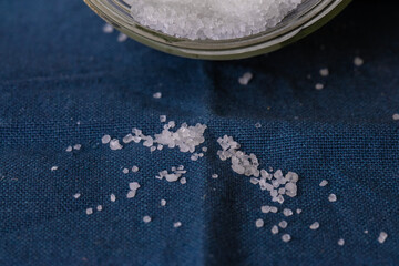 Close-up of sugar granules on a blue canvas