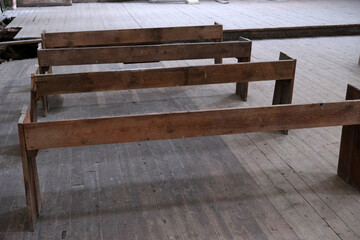 old wooden benches in a catholic church