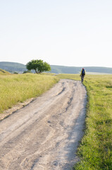 A young tourist with a backpack travels