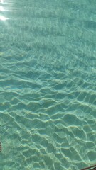 Sunlight reflecting on gentle water waves – natural abstract background