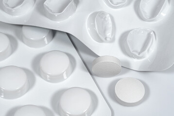 Blister pack with pills and used blister without tablets close up