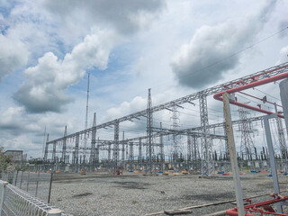 overhead power line to distribute electricity to the community with a blue sky background