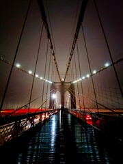 Artistic photograph of the Brooklyn Bridge in New York City, highlighting its architectural...