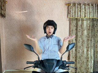 happy man wearing helmet with a smile and with open arms