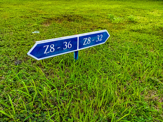 road sign in the grass, Side view of thirty six 36 or thirty two 32, Latin number and alphabetical two, three, six and Z eight alphabet. number 36 Z until 32 Z8, Number signage board home