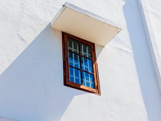 windows in the old house, side view of isolated de Javasche bank windows, square dark brown window
