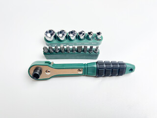 Preset torque wrench with cap head. Green and black coated handle. Working tool with reversible...