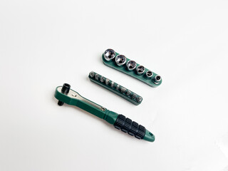 Preset torque wrench with cap head. Green and black coated handle. Working tool with reversible...