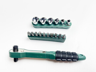 Preset torque wrench with cap head. Green and black coated handle. Working tool with reversible...