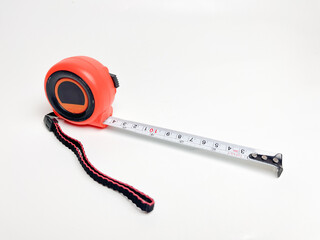 Black and orange measuring tape that can be stretched and held at a distance of 10 cm, measuring...