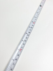 Black and orange measuring tape that can be stretched and held at a distance of 10 cm, measuring...