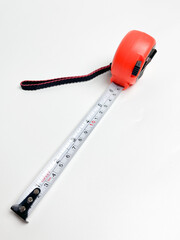 Black and orange measuring tape that can be stretched and held at a distance of 10 cm, measuring...