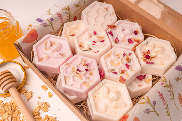 Handmade small honeycomb oatmeal and honey soaps bars in box. Aesthetic soap on white background with copy space