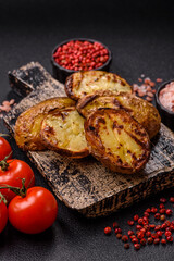 Food, potatoes cut in halves or slices grilled. Cooked baked potatoes