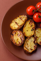 Food, potatoes cut in halves or slices grilled. Cooked baked potatoes