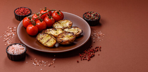 Food, potatoes cut in halves or slices grilled. Cooked baked potatoes