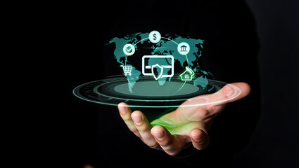 A digital symbol of global business connection, a human hand holds a dollar sign on a screen