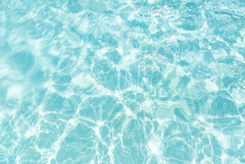Soothing turquoise water with sunlight patterns