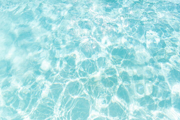 Clear turquoise water surface with sun reflections