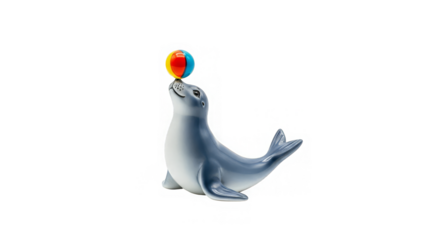 A playful seal balances a vibrant striped ball on its nose against a dark background, isolated
