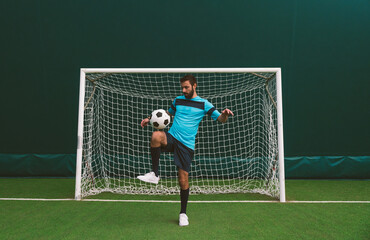 Cinematic image of a soccer freestyle player making tricks with the ball.