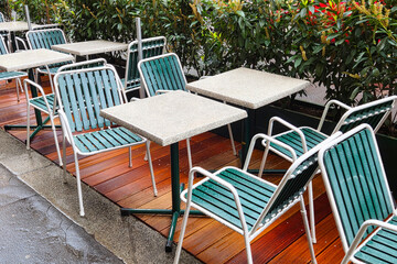 Outdoor Cafe Seating on Rainy Day with Modern Metal Furniture Design