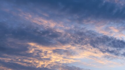 Fototapeta premium Serene Golden Dusk Blue Cloudy Sky Background – Warm-Cool Color Harmony, Soft Cloud Glows, Tranquil Evening Atmosphere