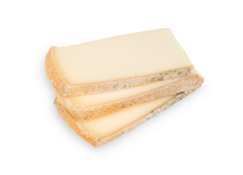 Raclette Cheese slices. Isolated stack of fresh sliced raclette cheese. Traditional Swiss meal or French cheese dinner. Melting cheese for grill trays at the table. Selective focus. White background.